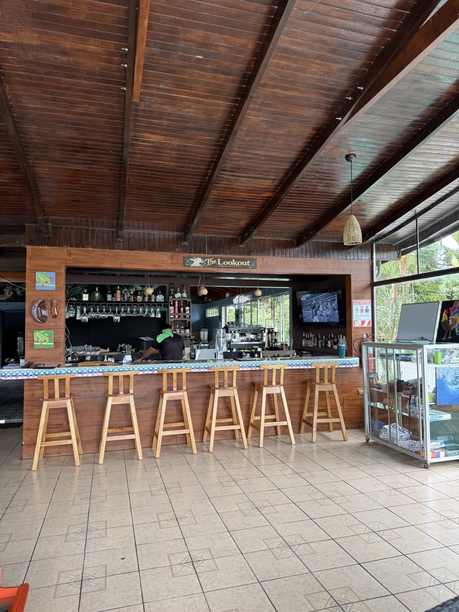 Rustic bar with The Lookout Restaurant goat logo sign